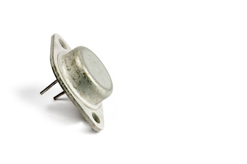 Radio element, a very old diode close-up, on a white background.