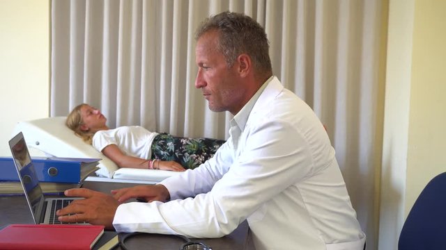 Doctor Consults With Patient