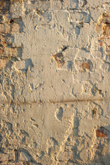 The surface of the plastered old brick wall