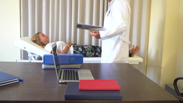 Doctor Consults With Patient