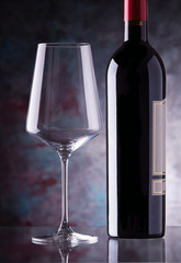 red wine glass and bottle