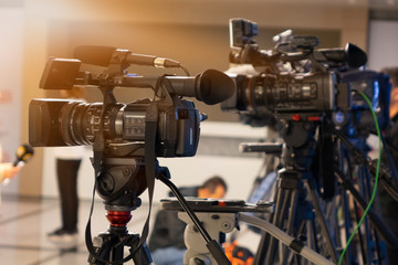 News conference. Filming an event with a video camera.