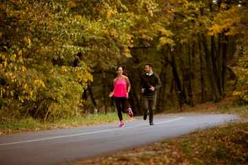 Fototapeta premium Young people jogging and exercising in nature