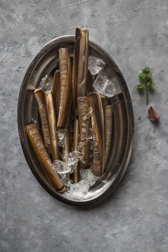 Plate with ice and razor clams