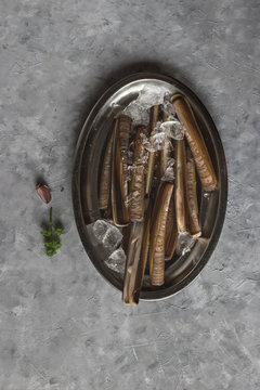 Plate with ice and razor clams