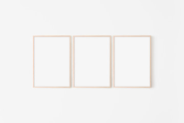 Set of three large 50x70, 20x28, a3,a4, Wooden frame mockup on white wall. Poster mockup. Clean,...