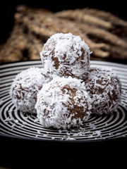 Healthy organic date energy balls with coconut flakes, dried fruits and nuts. Food for healthy lifestyle.