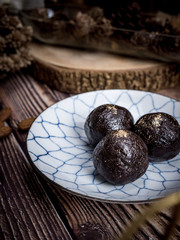 Healthy organic date energy balls with dark chocolate, dried fruits and nuts. Food for healthy lifestyle.