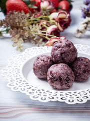 Healthy organic date energy balls with berry, dried fruits and nuts. Food for healthy lifestyle.
