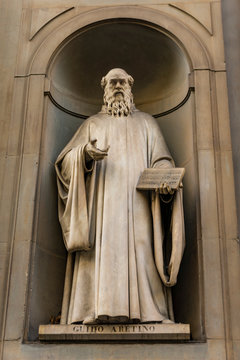 Musician Guido Aretino monument in Florence, Italy