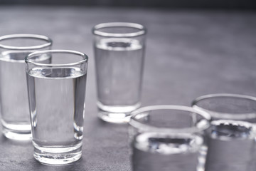 Russian vodka shots on black table, copy space
