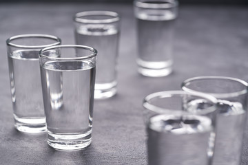 Russian vodka shots on black table, copy space