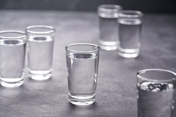Russian vodka shots on black table, copy space