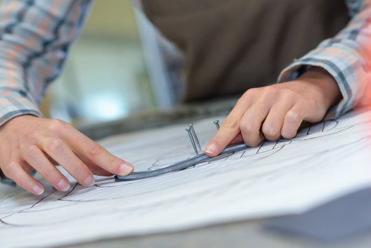 Closeup of artist attaching