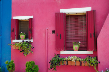 Fototapeta na wymiar View of house windows with shutter in the Burano Venice Italy