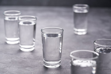 Russian vodka shots on black table, copy space