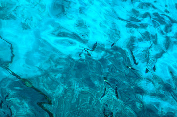 Fototapeta na wymiar Beautiful blue sea transparent surface with fish. Oceanic fish theme for background. Stock photo for tourist design