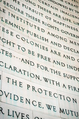 Pursuit of happiness inscription excerpted from the Declaration of Independence carved in white...