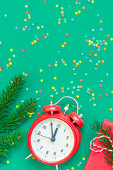 Christmas pattern flat lay with red alarm clock
