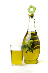 bottle of olive oil with olives
