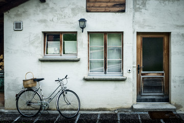 Fototapeta na wymiar Bike leaning outside home in Swiss Alps