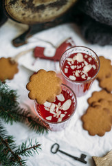 Obraz na płótnie Canvas Gingerbread and Glogg, also known as Scandinavian mulled win is a traditional Scandinavian warming drink. Christmas background and concept for design