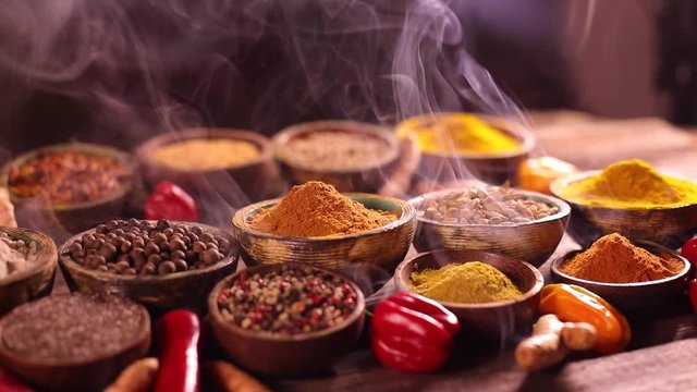 Assorted Spices and wooden bowl of smoke