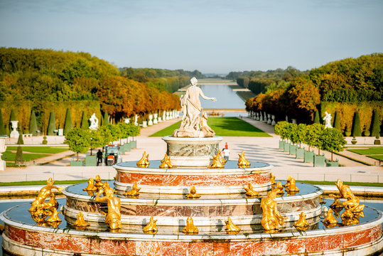 Versailles gardens with Latona fountain and Grand canal during the morning light in Versailles, France