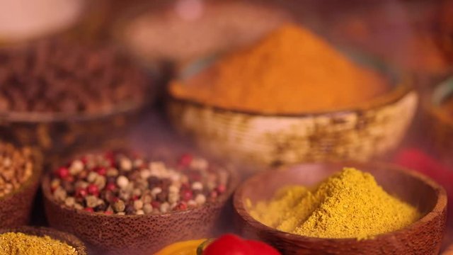 Assorted Spices and wooden bowl of smoke