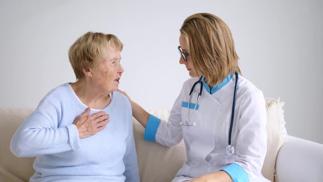 Doctor Explaining Diagnosis To Her Female Senior Patient With Complaints