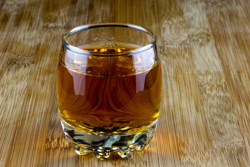 Glass of Scotch Whisky on a Wooden Surface