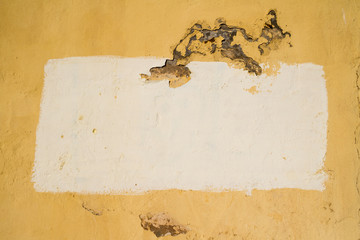 A painted area on a stucco background creating a frame with copy space.