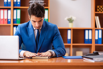 Young employee working in the office