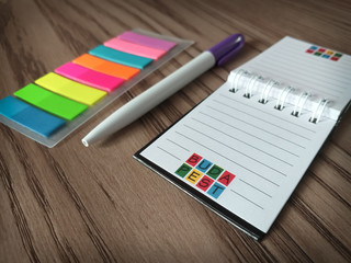notebook and pen from Hungary on the wooden table