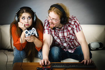 Pc gamer man and woman with game pad