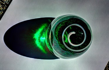 green with white spiral glass paperweight	