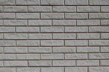 Wall of gray brick imitation granite