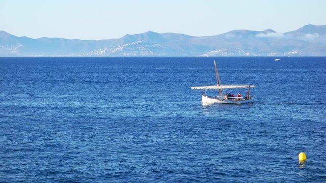 Traditional mediterranean vessel named Llagut or Llaut sailing in the wind through the waves. (HD).The llaut is the traditional trawl fishing vessel of the Balearic Islands and Catalan coast