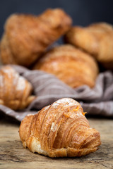 freshly baked buns with almonds. Croissants and brioches