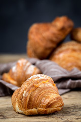 freshly baked buns with almonds. Croissants and brioches