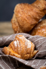 freshly baked buns with almonds. Croissants and brioches