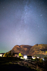 Beautiful Night Sky Milky Way Stars Galaxy with Mountains and Rocks in Norway Scandinavia