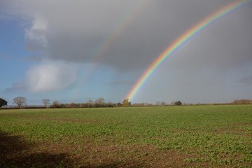 double rainbow over lincolnshire farmland