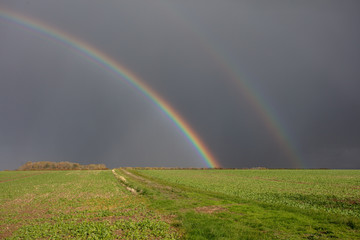 double rainbow over farmland in lincolnshire