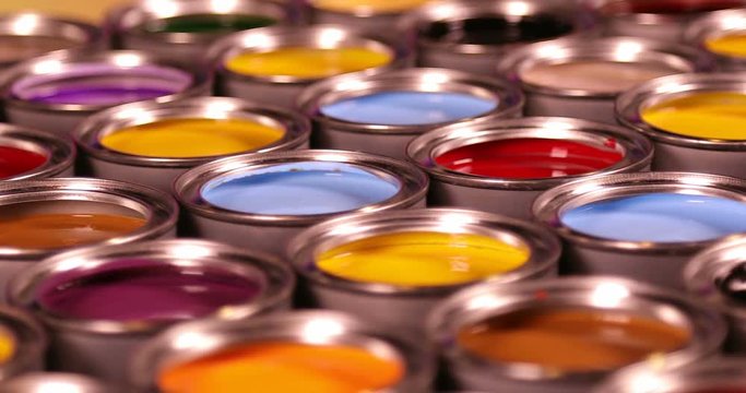 Full Buckets of rainbow colored oil paint 