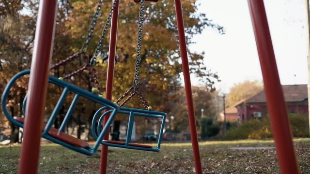 Abandoned swing set at children's playground