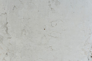 Fototapeta premium Wall fragment with scratches and cracks. It can be used as a background