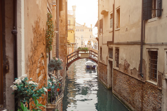 Venice, beautiful romantic italian city on sea with great canal and gondolas. View of venetian narrow canal. Venice is a popular tourist destination of Europe.