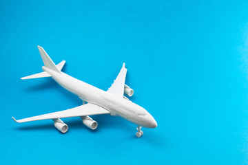 Model plane, airplane on blue background. travel and transportation idea.
