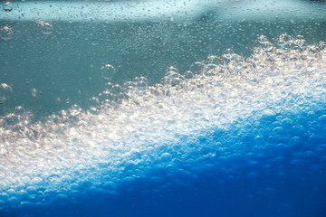 Abstract background and texture of blue bubbles with backlight